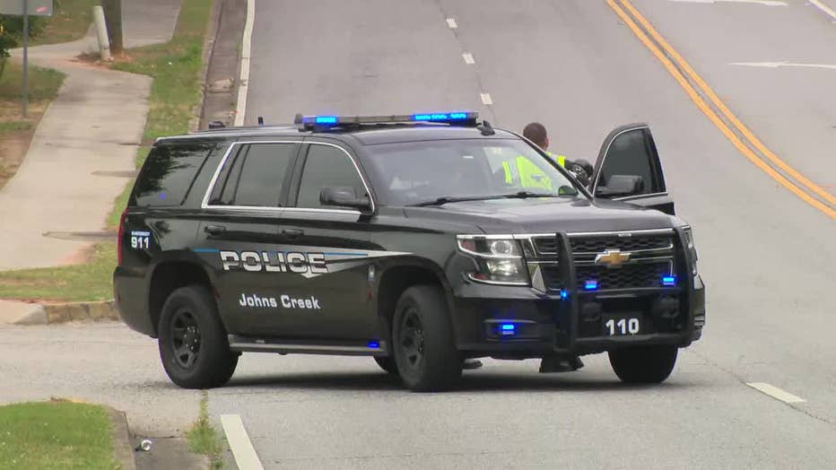 Police closed a road to investigate a "suspicious package" near a Johns Creek women's clinic.