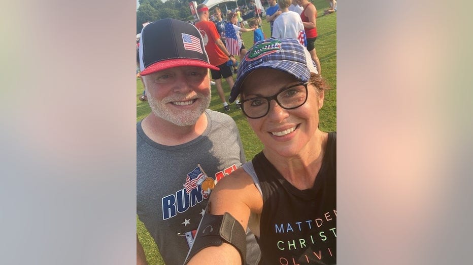 Couple poses for a selfie after running the Peachtree Road Race.