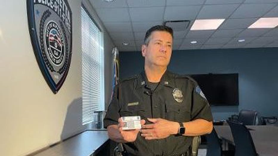 Captain Mike Stewart shows off the new Police Smart Card used by the Alpharetta Police Department.