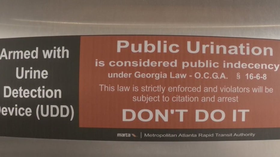 A sign inside a MARTA train station warns about public urination.