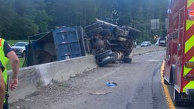 Dump truck overturns on I-575 North in Canton