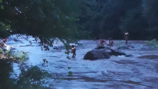 Firefighters rescue adults trapped in rising Gwinnett County river
