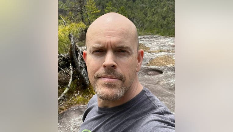 Spalding County Sheriff's Office Deputy Jamie Reynolds died in a patrol car Sunday morning when a tree fell and crushed it, Sheriff Darrell Dix said.