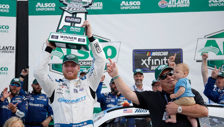 HAMPTON, GEORGIA - JULY 09: Austin Hill, driver of the #21 Bennett Transportation and Logistics Chevrolet, celebrates in victory lane after winning the NASCAR Xfinity Series Alsco Uniforms 250 at Atlanta Motor Speedway on July 09, 2022 in Hampton, Georgia. (Photo by Jared C. Tilton/Getty Images)