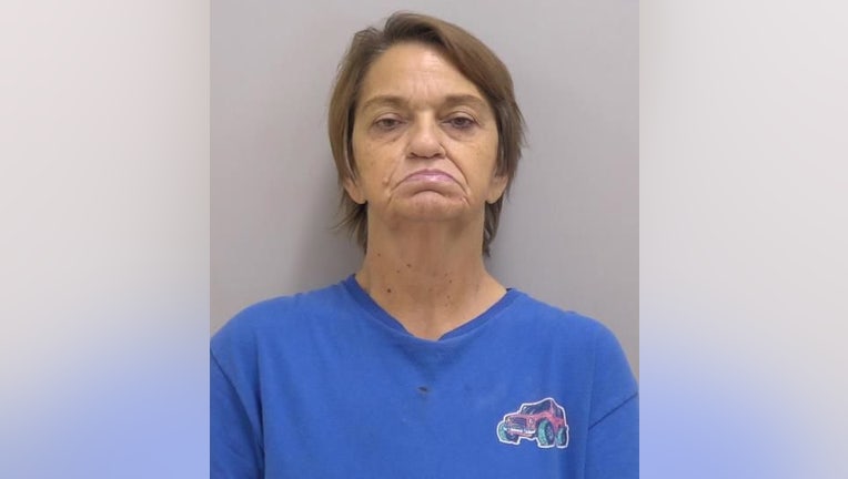 Police said Maude Annette Glisson is charged with aggravated assault, aggravated battery and gun possession charges. She is in Bartow County Jail.