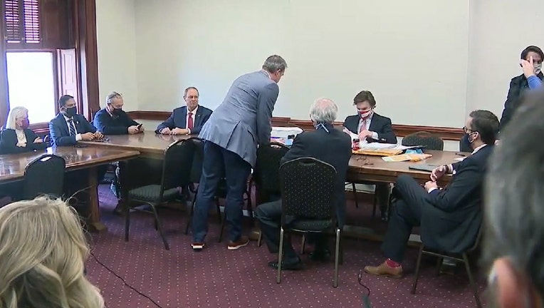 A group of so-called fake electors, all Republicans, meet in a hearing room at the Georgia Capitol to