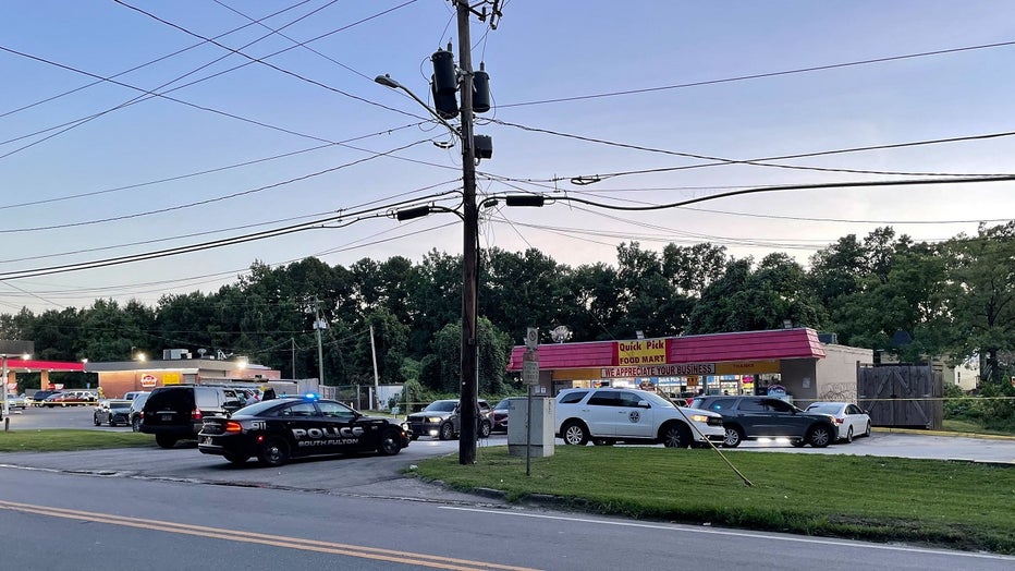 South Fulton police surround a convenience store after a clerk was shot dead during a robbery on July 26, 2022.