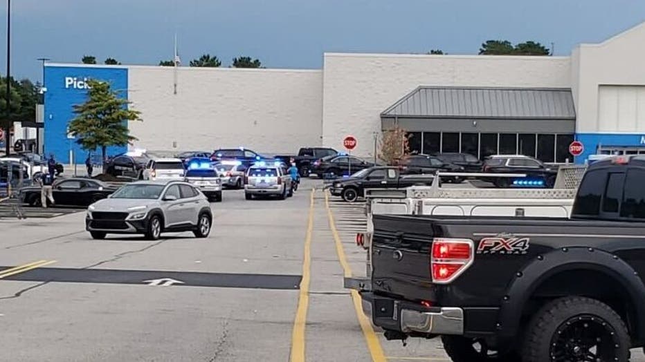 Police surround the Walmart in Riverdale after reports of shots being fired on July 7, 2022.