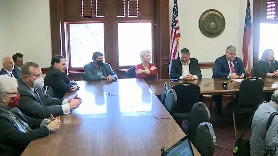 A group of so-called fake electors, all Republicans, meet in a hearing room at the Georgia Capitol to