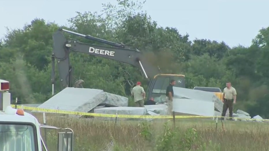 The Georgia Guidestones in a heap on the ground after authorities torn them down when they were damaged by an explosion.