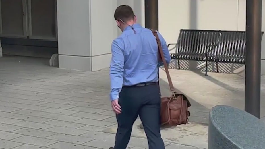 Gov. Brian Kemp's campaign communication director Cody Hall walks into the Fulton County Courthouse on July 12, 2022.