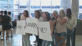 Surprise engagement at Atlanta's airport was a family affair