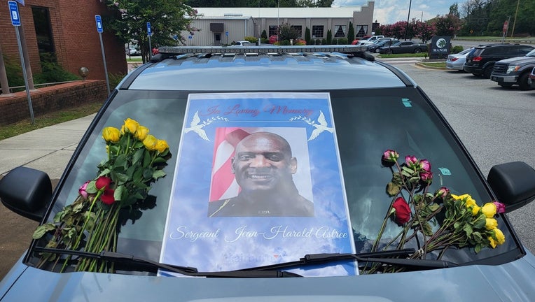 Fairburn police have set up a makeshift memorial in front of its headquarters for a beloved sergeant killed in a crash last week.