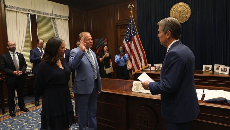 Gov. Brian Kemp swears in Mike Register as the head of the Georgia Bureau of Investigation on August 25, 2022.