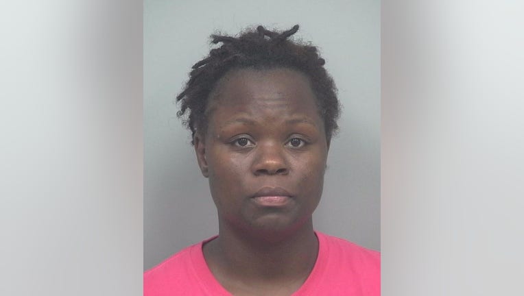 Police said Renae Tolbert is charged with robbery by sudden snatching and criminal attempt to robbery for allegedly trying to steal dogs from two different people. 