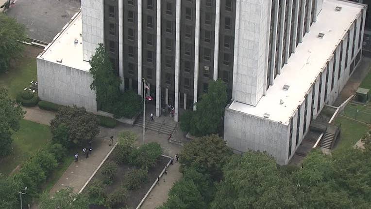 Officials outside the DeKalb County Courthouse following an evacuation on Thursday.