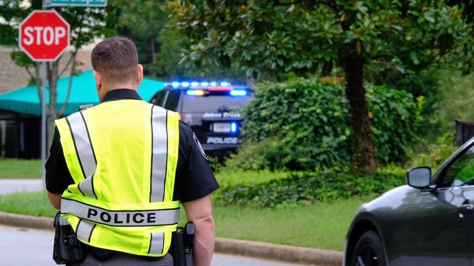 Police investigate a shooting in Johns Creek on Aug. 23, 2022.
