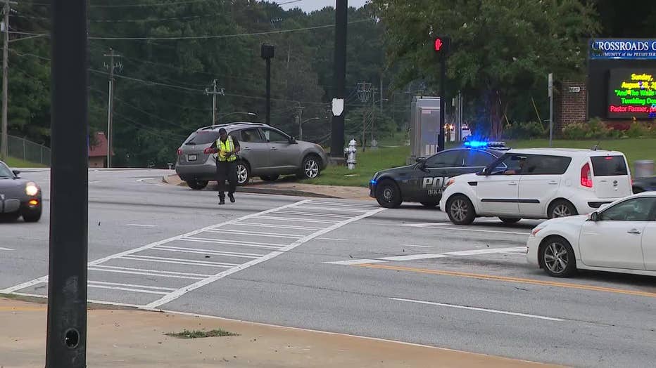 DeKalb County police investigate a shooting near the intersection of Panola and Redan roads on August 23, 2022.