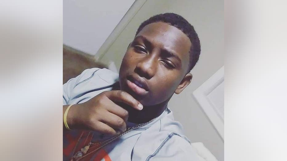 Young African American man looks pensive while taking a photo of himself.