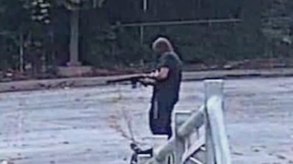 Police say a man was caught on surveillance video firing a rifle in the parking lot of a MARTA station on August 8, 2022.