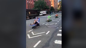 Motorized lawn chairs zip down NYC bike lane