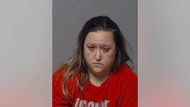 Woman accused of attempting to sneak contraband into a broken prison window with rope