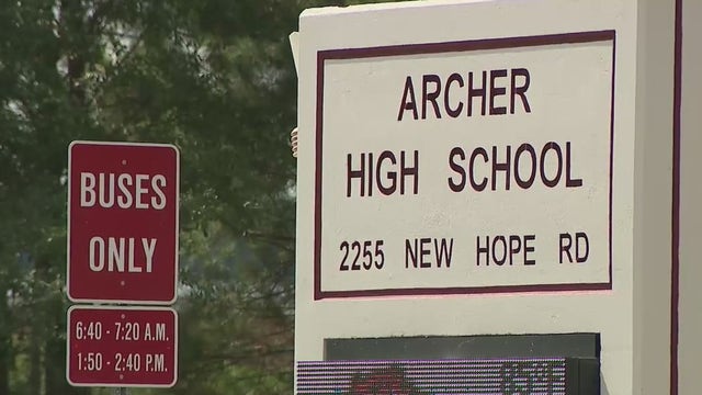 Armed man shows up to high school football game with rifle and two handguns, school says