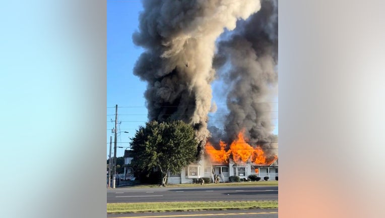 Fire shoots through the roof of Heirloom Bakeshop located on GA-54 in Sharpsburg, on Sept. 21, 2022.