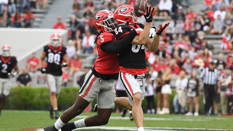 ATHENS, GA - APRIL 16: Georgia Bulldogs Wide Receiver Ladd McConkey (84) reaches for the ball as Georgia Bulldogs Defensive Back Kelee Ringo (5) defends during the Georgia Bulldogs G-Day intra-squad spring game on April 16, 2022, at Sanford Stadium in Athens, GA.(Photo by Jeffrey Vest/Icon Sportswire via Getty Images)