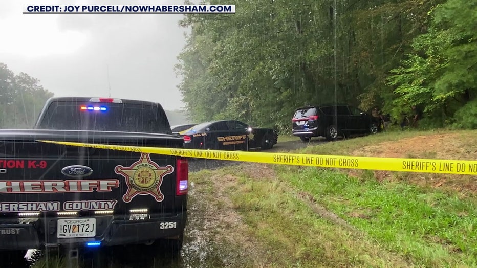 Investigators in Habersham County where Debbie Collier's body was discovered.