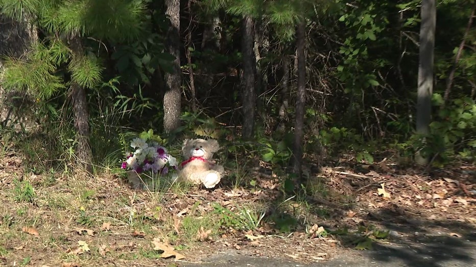 A memorial sits on the side of the road where the Athens woman’s body was found.