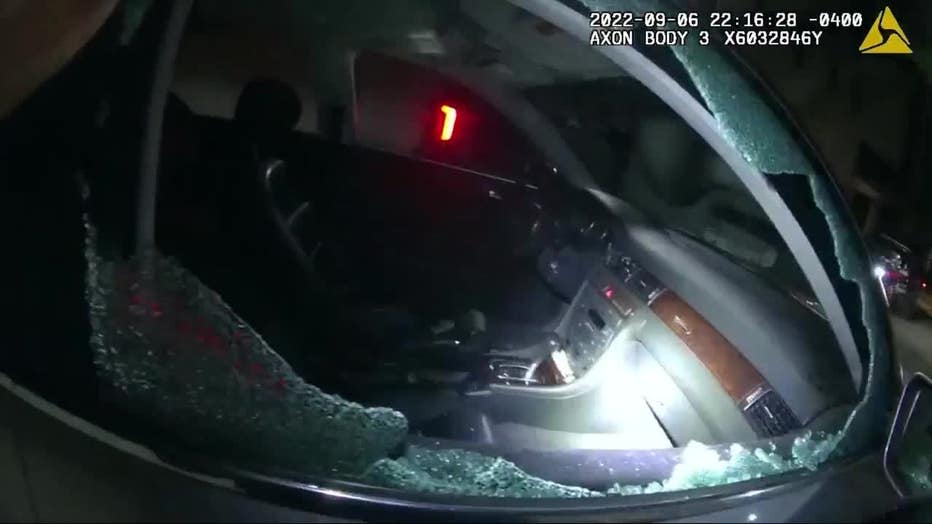 Body camera footage of a police investigating car break-ins at Buckhead Village.