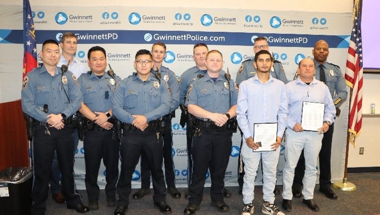 Gwinnett County Police Chief J.D. McClure recognized Otto and Anderson Ortiz for their bravery in helping an officer in distress.