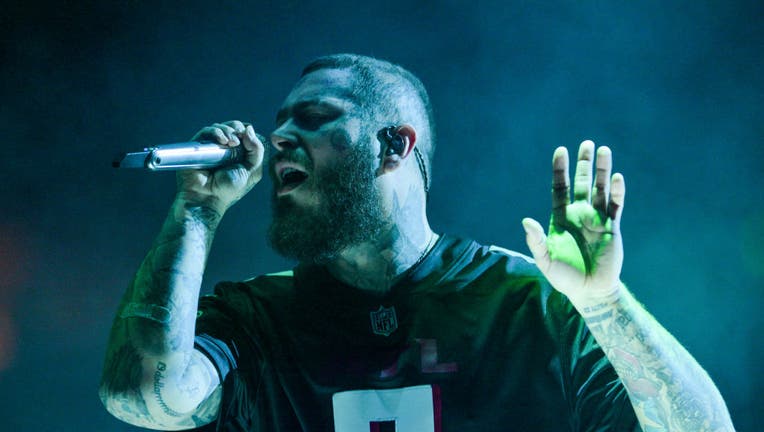 ATLANTA, GA - OCTOBER 18: Post Malone performs onstage during his "Twelve Carat Toothache" tour at State Farm Arena on October 18, 2022 in Atlanta, Georgia.(Photo by Prince Williams/Wireimage)