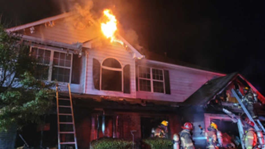 Crews arrived at around 8:14 p.m. Friday and saw the front of the two-story home on River Pass Court burning.