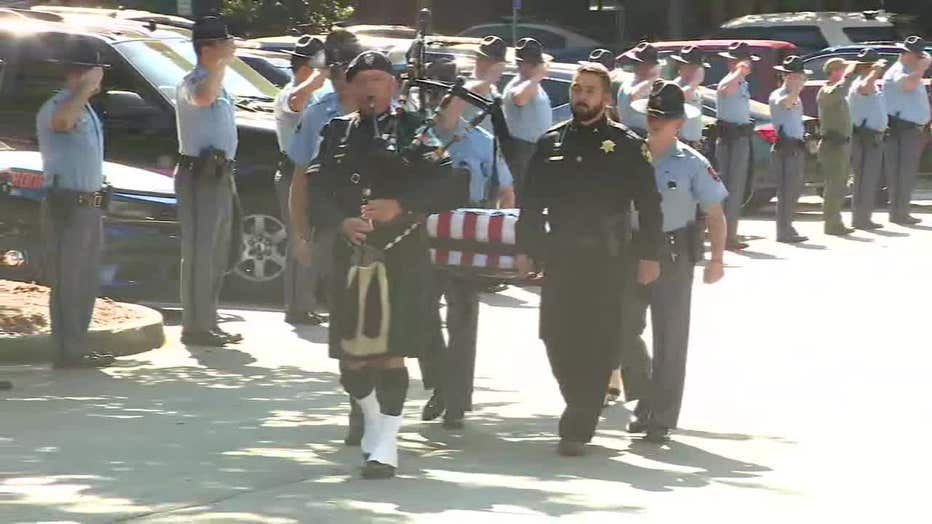 Various law enforcement agencies join the Georgia State Patrol in honoring K-9 Figo, who killed in the line of duty last week, with a procession on Oct. 10, 2022.