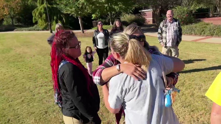 Members of the Missing or Murdered Moms comfort the mother of Natalie Jones on the second anniversary of the discovery of her daughter's body on Oct. 6, 2022.