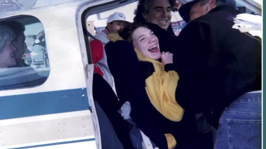 Rick Amber, seen here taking a group of children up for a flight.