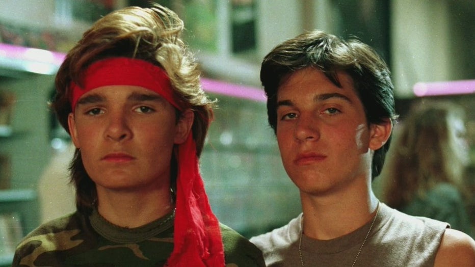 Corey Feldman (right) and Jamison Newlander (left) starred as the iconic Edgar and Alan Frog in the film (Warner Bros.).