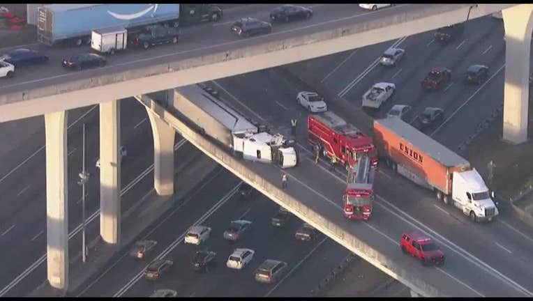 SKYFOX footage of overturned tractor-trailer on Spaghetti Junction ramp.