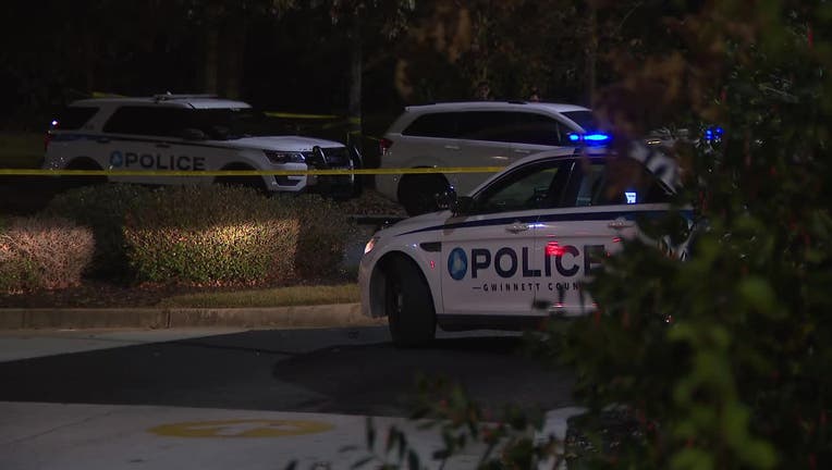 Police tape surrounds the scene of a deadly shooting along Stephen Center Drive in Gwinnett County on Nov. 9, 2022.