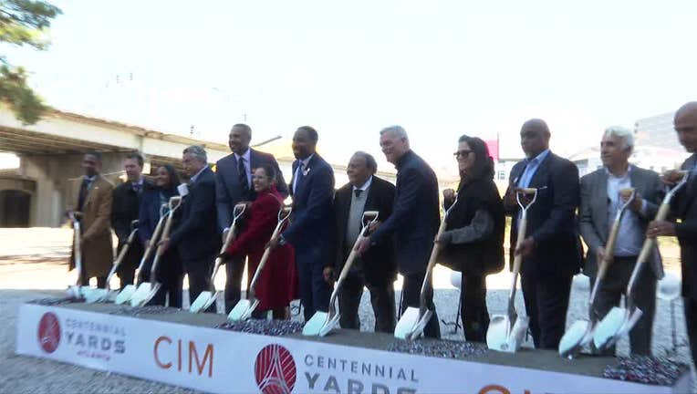 Dignitaries pose during a groundbreaking ceremony for Centennial Yards in Downtown Atlanta on Nov. 17, 2022.