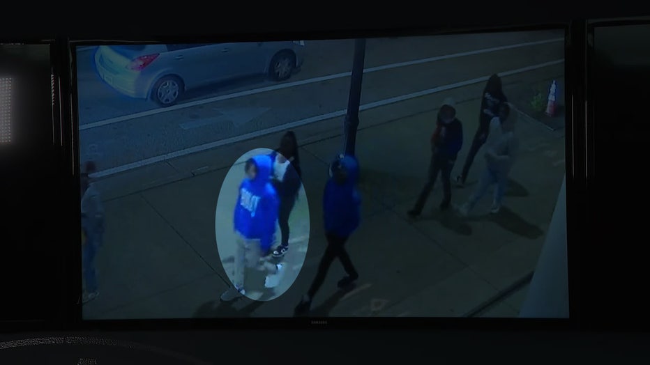 Atlanta police investigators said this person wearing a blue hoodie with white letters on the front is one of two suspects in a shooting near Atlantic Station.