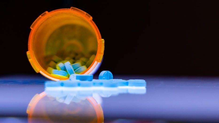 Vial of small Adderall pills
