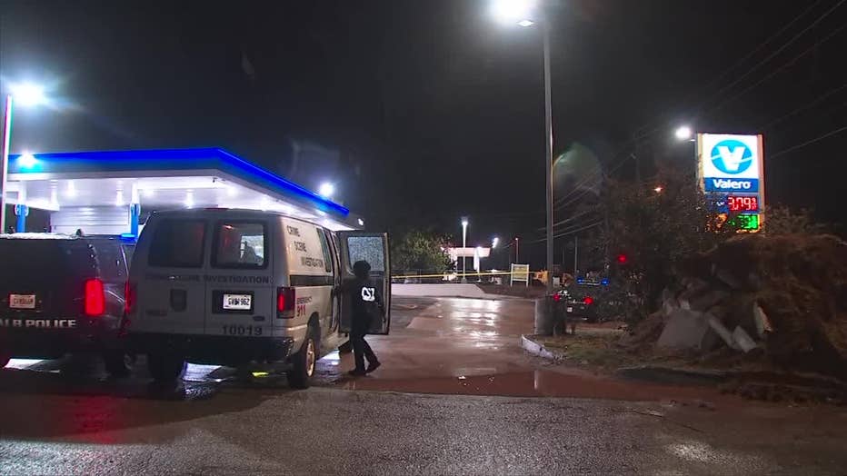 DeKalb County police investigate a scene at a gas station off Glenwood Road where the victims drove to get help after being shot on Nov. 10, 2022.