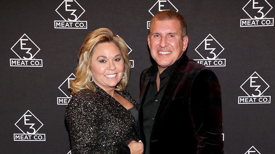 NASHVILLE, TENNESSEE - NOVEMBER 20: Julie Chrisley (L) and Todd Chrisley attend the grand opening of E3 Chophouse Nashville on November 20, 2019 in Nashville, Tennessee. (Photo by Danielle Del Valle/Getty Images for E3 Chophouse Nashville)