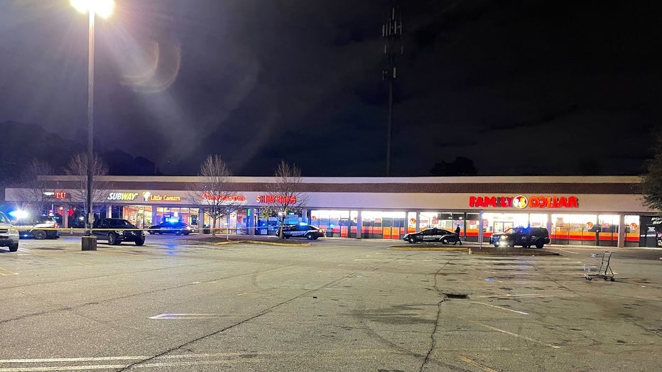 DeKalb County police investigate a double shooting in the parking lot of a shopping center along Tucker Norcross Road on Nov. 9, 2022.