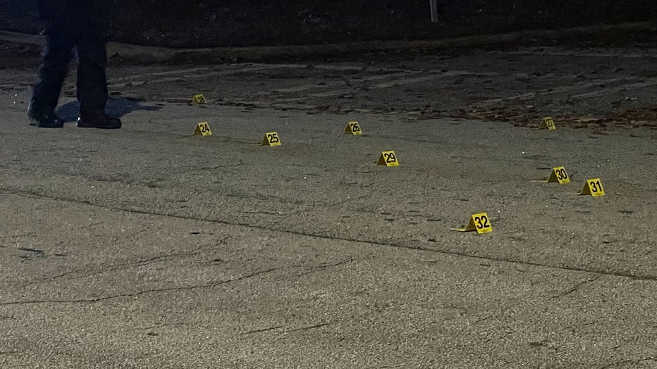 Numbered markers help count the spent shell casings found outside a Stonecrest area home after a deadly double shooting on Nov. 7, 2022.