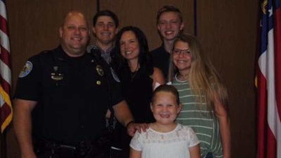 Lt. Roy Collar, former Cobb County police officer, now with the Chamblee Police Department, and his family.