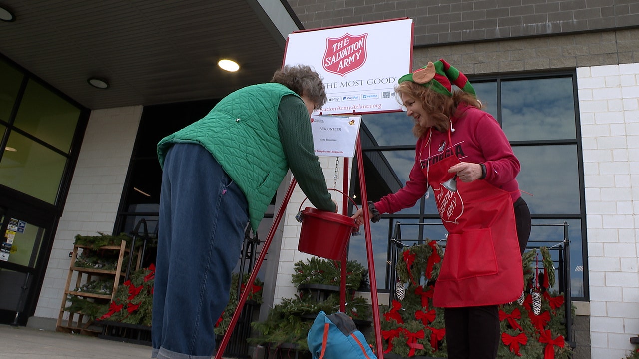 The Salvation Army's red kettle bells ring outside Kroger this holiday  season